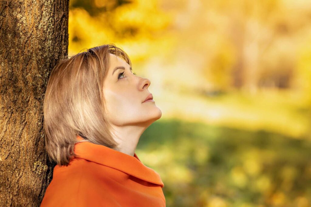 Young woman looking into the distance | Featured image for the Domestic Violence Order page by The Law People.