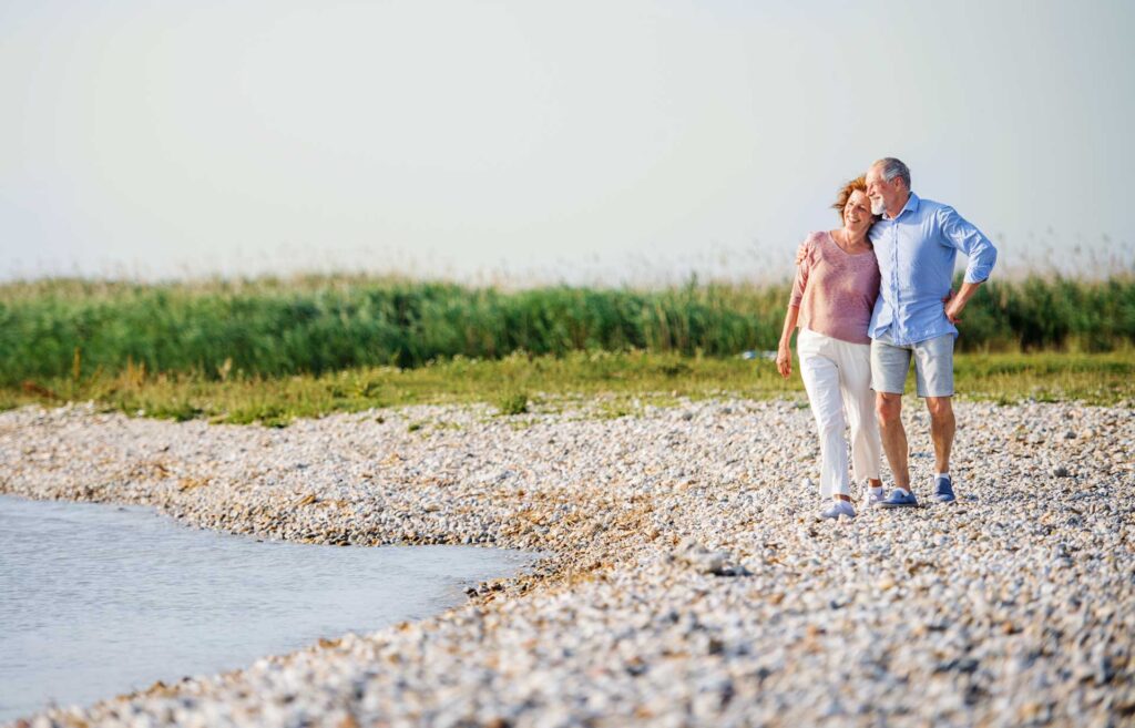 A couple walking along the riverbanks
